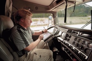 New rules would require commercial truck drivers to use an electronic logging device instead of a handwritten log to record hours on the road. 